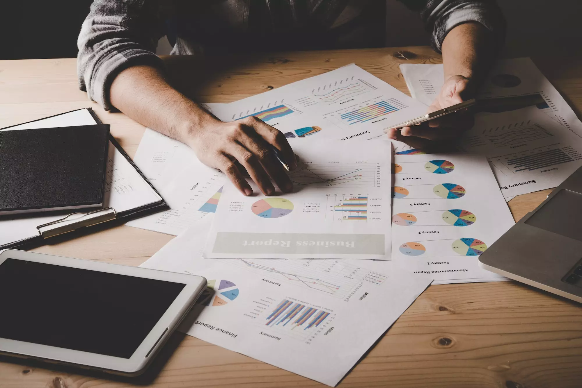 Young businessman analyzing data in office.